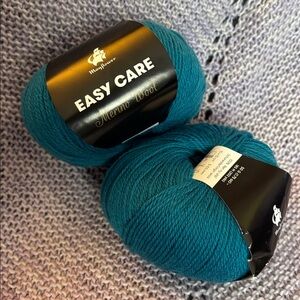 2 balls of Mayflower Easy Care Merino Fingering Yarn